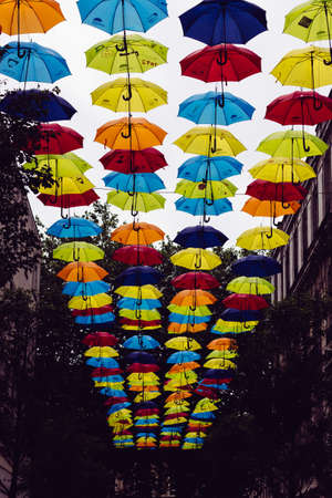 LIVERPOOL, UNITED KINGDOM - Jul 06, 2017: A vertical low angle shot of colorful umbrellas hanged in...