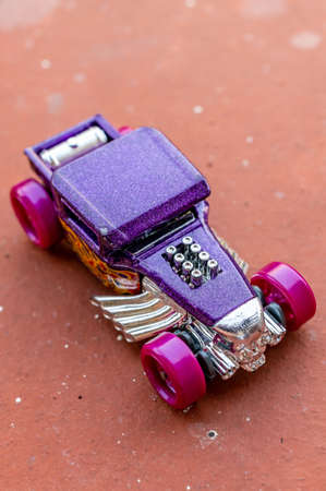 POZNAN, POLAND - Jul 01, 2020: Mattel Hot Wheels purple toy race car