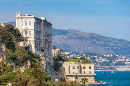 The famous Monaco oceanographic museum at the board of the ocean and mountains in the background