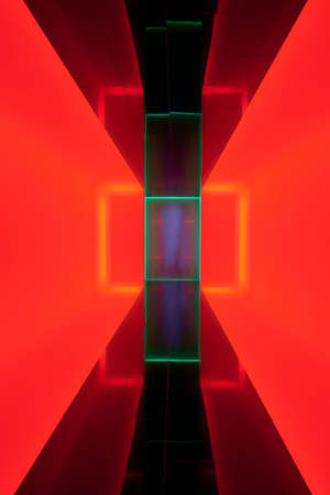 A vertical shot of an illuminated red room with neon lightsの写真素材