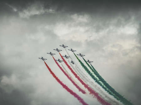 LONDON, UNITED KINGDOM - Jul 24, 2019: Freece Tricolori display team flying Aermacchi MB-339 jets.のeditorial素材
