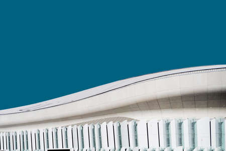 A low angle shot of a white concrete building under the blue skyの写真素材