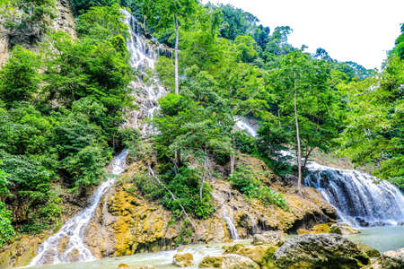 A beautiful waterfall in the mountains in Sumba, Indonesiaの写真素材