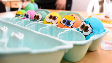 A lot of painted eggs with stickers ina box - Easter concept