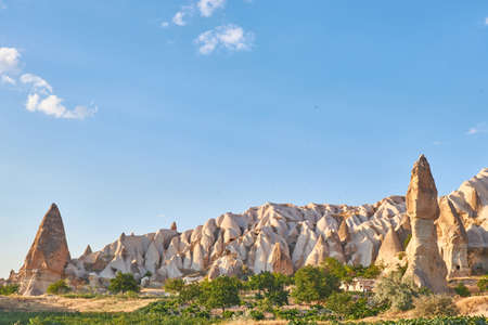 A beautiful shot of a mountain with a blue sky in the background at daytime