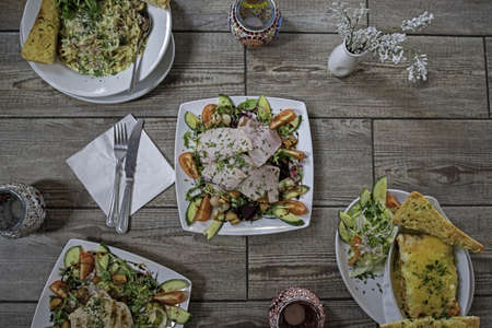 An overhead shot of dishes on a wooden surface