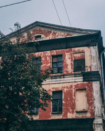 A vertical shot of an old building with rusty wallsの写真素材