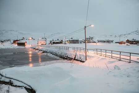 A marvelous magical scenery of a neighborhood full of lights in Skarsvag, Norwayの写真素材