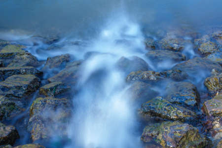 A small waterfall surrounded by rocks in the Maksimir Park in Zagreb, Croatia