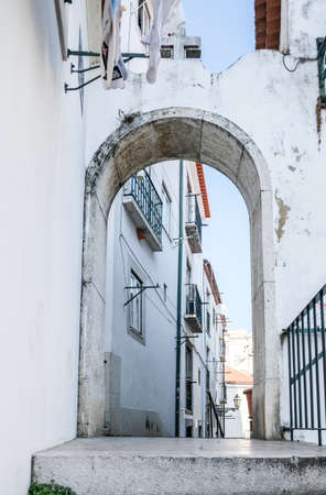 A vertical shot of an old street-corner exterior under the clear skyの写真素材