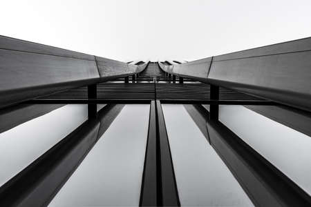 A greyscale of modern architecture under the lights - a cool picture for backgrounds and wallpapers