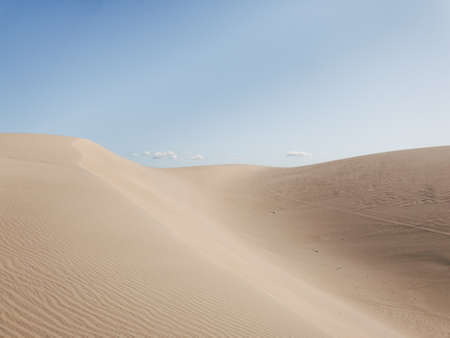 A beautiful scenery of a desert under the clear sky