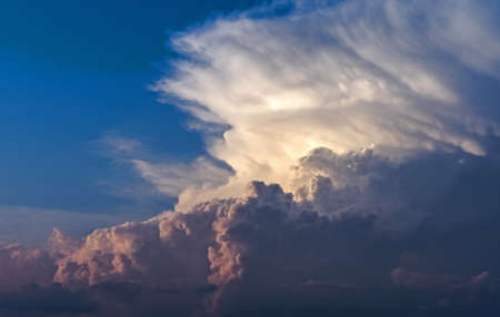A beautiful shot of white puffy clouds - great for a cool backgroundの写真素材