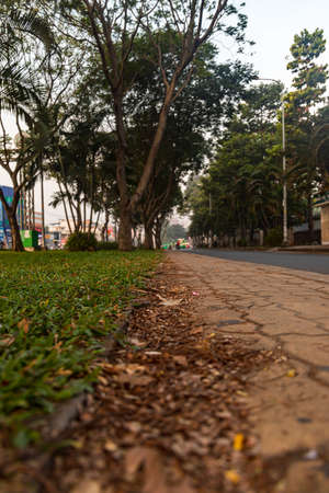 A vertical shot of a street under the clear sky in BÃ¬nh Thá», Vietnamの写真素材