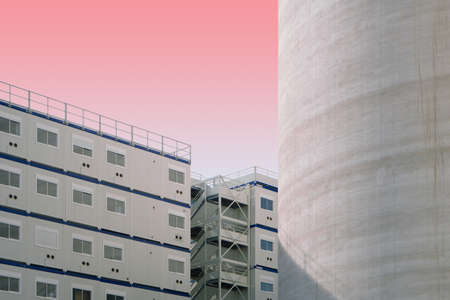 The white and blue concrete structures on a pink background