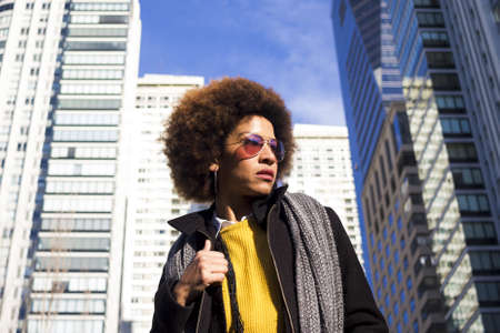 An African-American female wearing sunglasses in Micaela Bastidas Park in Buenos Aires, Argentinaの写真素材