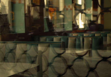 The inside of the restaurant captured from the outside of a glass window with patternsの写真素材
