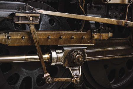 A closeup of a dirty and rusty railroad wagon under sunlight