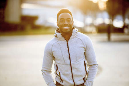 A shallow focus shot of an attractive African American male smiling at the cameraの写真素材