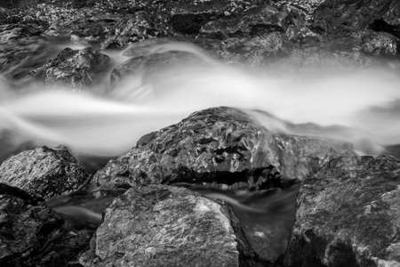 A greyscale of a small waterfall in the Maksimir park in Zagreb, Croatia