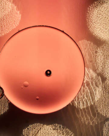 Photos created by adding drops of oil into water and then creating some texture using different elements.の写真素材