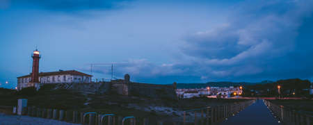 The Esposende city surrounded by greenery and buildings under a cloudy sky during the eveningの写真素材