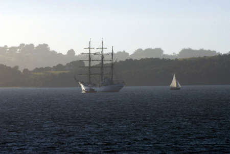 A beautiful shot of the sea with a ship in the distanceの写真素材