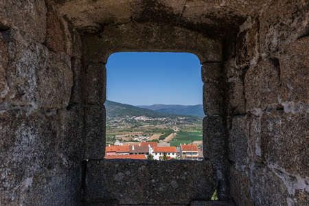 The Castle of Belmonte surrounded by greenery under sunlight in Beiras in Portugalの写真素材
