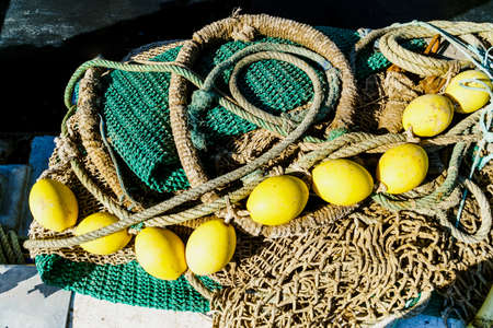 A high angle shot of a rope with big yellow beads used for fishing