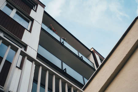 A low angle shot of a modern building touching the clear skyの写真素材