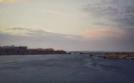 A breathtaking sunset over the ocean in Valletta  Malta