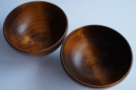 A vertical closeup shot of empty glasses with the blurred grey backgroundの写真素材