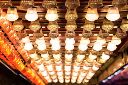 A low angle shot of rows of lamps outside during Christmas holidaysの写真素材