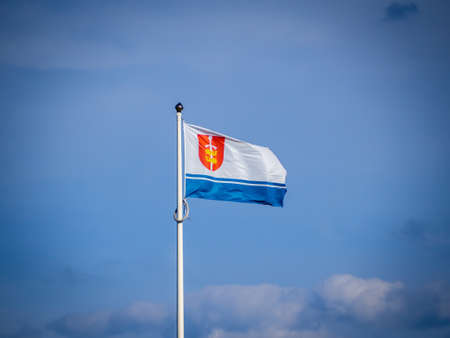 Gdynia polish city flag on blue sky backgroundの写真素材