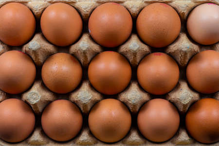 A high angle closeup shot of raw eggs