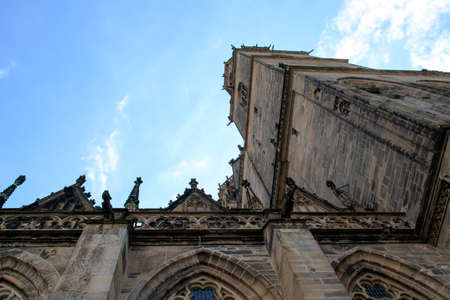 A low angle shot of the Cathedral of Magdeburg under the beautiful cloudy skyの写真素材