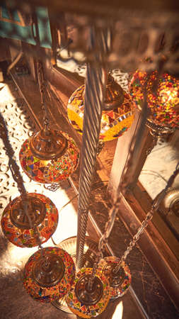 A vertical shot of an old vintage hanging lamp shadesの写真素材