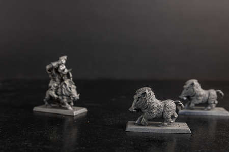 A grayscale selective focus shot of boar figurineの写真素材