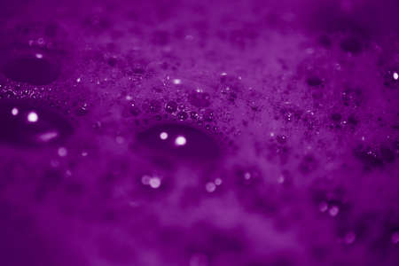 A background of purple soap bubbles - great for a cool background or wallpaperの写真素材