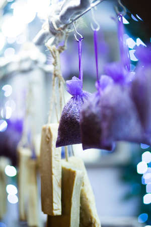 A vertical shot of small bads with lavender hanged on small hangers with blurred backgroundの写真素材