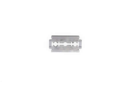 A closeup shot of a silver razor on a white background