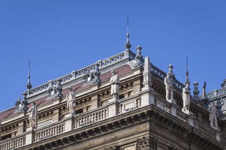 A low angle shot of the roof of the Budapest Opera House with beautiful sculpturesのeditorial素材