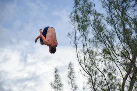NEGRIL, JAMAICA - Aug 05, 2016: Ricks CafÃ©, Negril, Jamaica â August 2016: David Colturi  cliff diver jumping off platformの写真素材