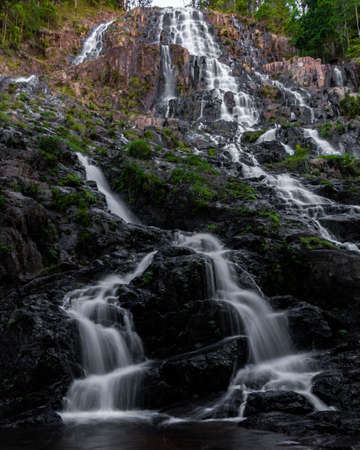 A low angle vertical shot of a beautiful waterfall