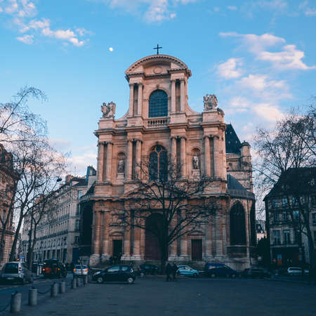 PARIS, FRANCE - Jan 17, 2020: Beautiful sunset and a church in Paris.のeditorial素材