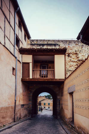 A vertical shot of buildings on old streets in the Jewish neighborhood in Segovia, Spainの写真素材