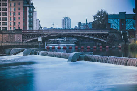 A high angle shot of a stunning waterfall flowing in the river in the middle of the cityの写真素材