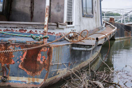 An abandoned rusty ship on the sea during daytimeの写真素材
