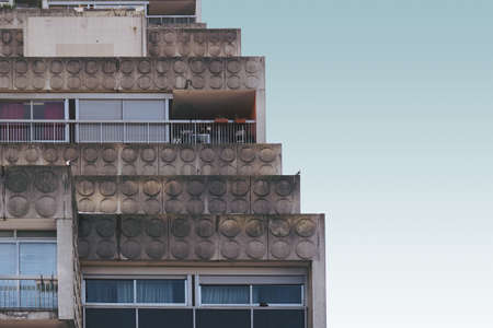 An old cement building with the blue sky in the backgroundの写真素材