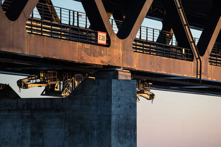 A closeup shot of the pillars under the bridge